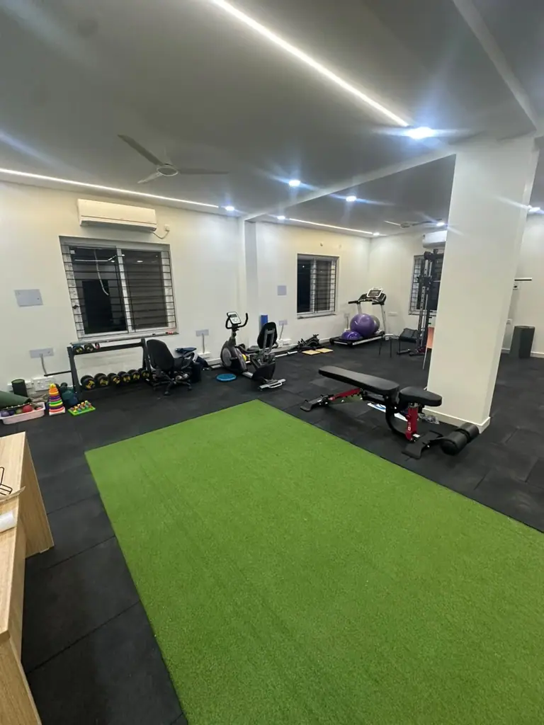 Rehabilitation gym with turf and strength equipment